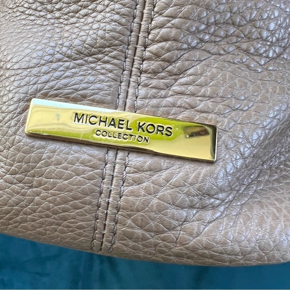 MICHAEL KORS COLLECTION
Skorpios Desert Tan Pebbled Leather Hobo
Bag $79… - Picture 8 of 16